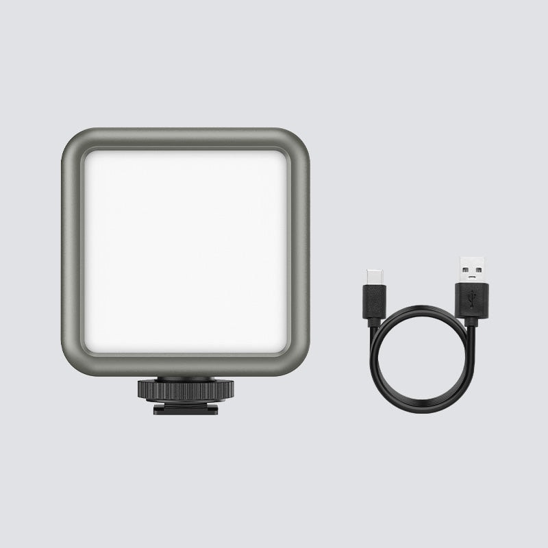 Rechargeable mini RGB LED light with adjustable colour and brightness for photography and videography. Compact design includes USB charging cable for versatile use.