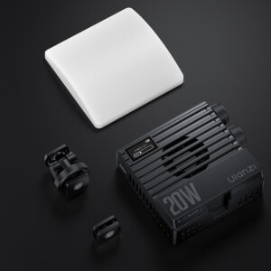 Ulanzi LE20 package contents flat lay showing main light unit, white silicone diffuser dome attachment, and black cold shoe mount bracket
