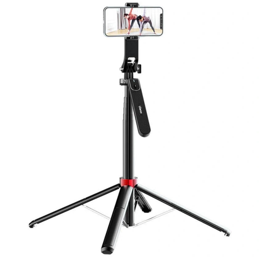 Ulanzi MA09 bluetooth selfie stick tripod fully extended with smartphone mounted in landscape mode, tripod legs spread open with red accent hinges