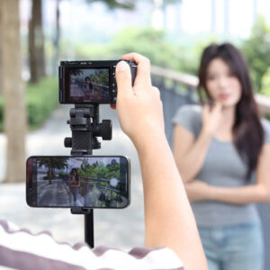 Ulanzi MT-78 used as handheld monopod with camera and smartphone mounted simultaneously for dual-device outdoor filming